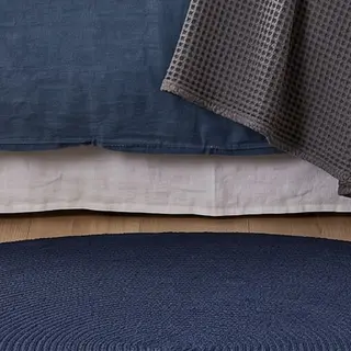 Illustration : Tapis rond tissé à plat en coton bleu marine, 120 cm